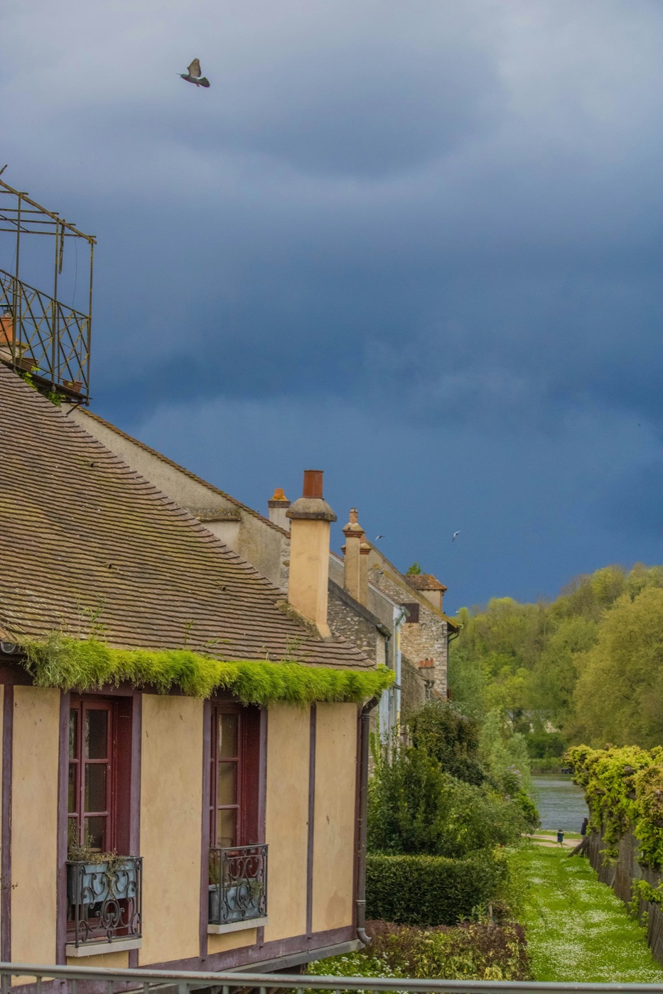 Texas neighborhood beneath approaching storm clouds